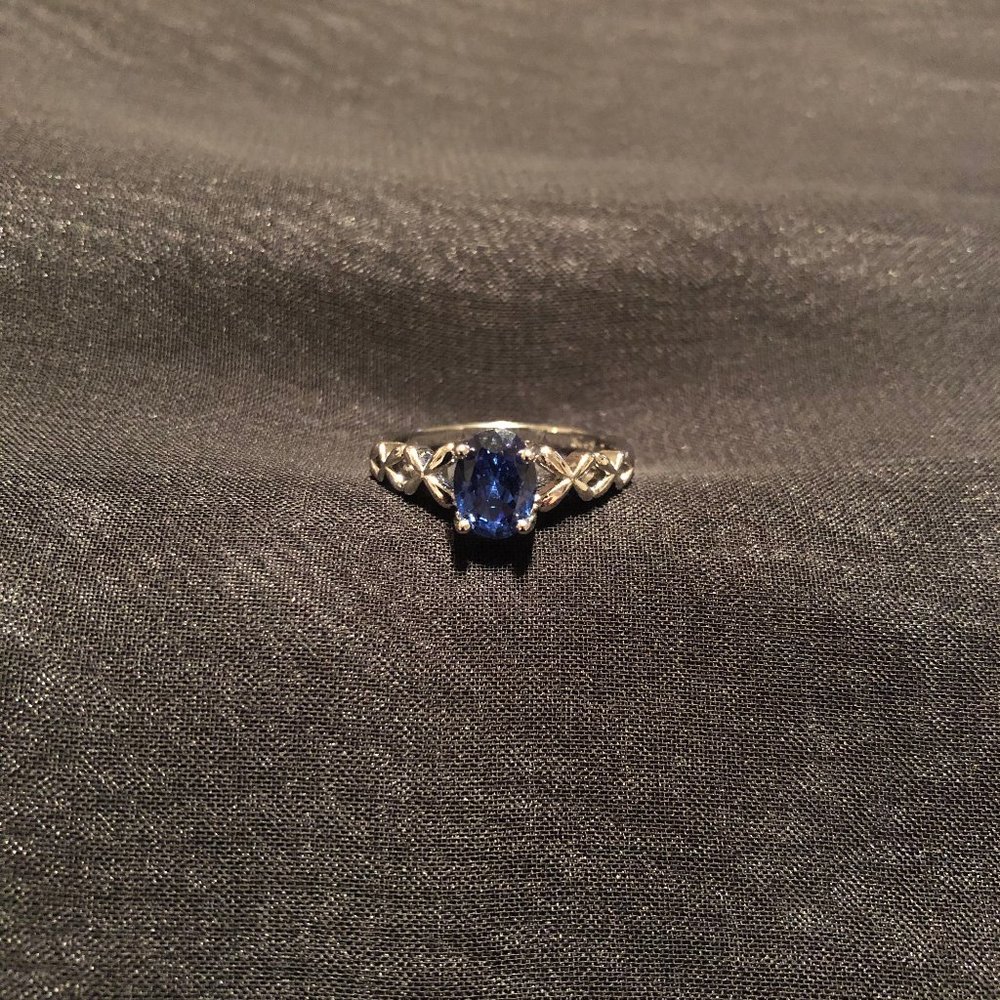 Described on purchase as Luxury Blue CZ Oval Shape 925 Sterling Silver Ring